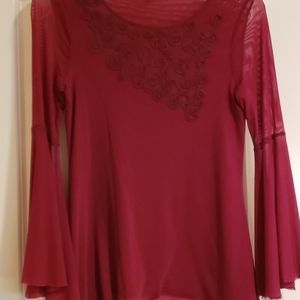 A slinky tunic top with bell sleeves